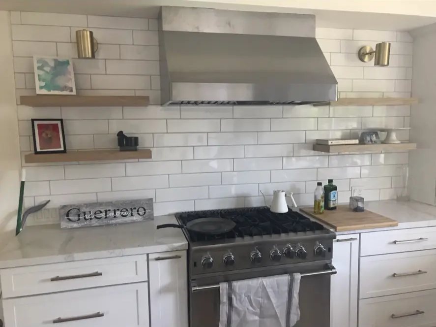 Cooking Zone — Subway Tile, Wood Shelves & Brass Sconces