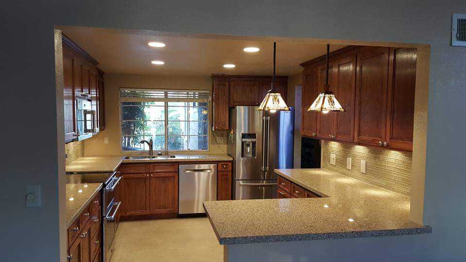 Traditional Oak Kitchen — Granite Counters & Stone Pendants