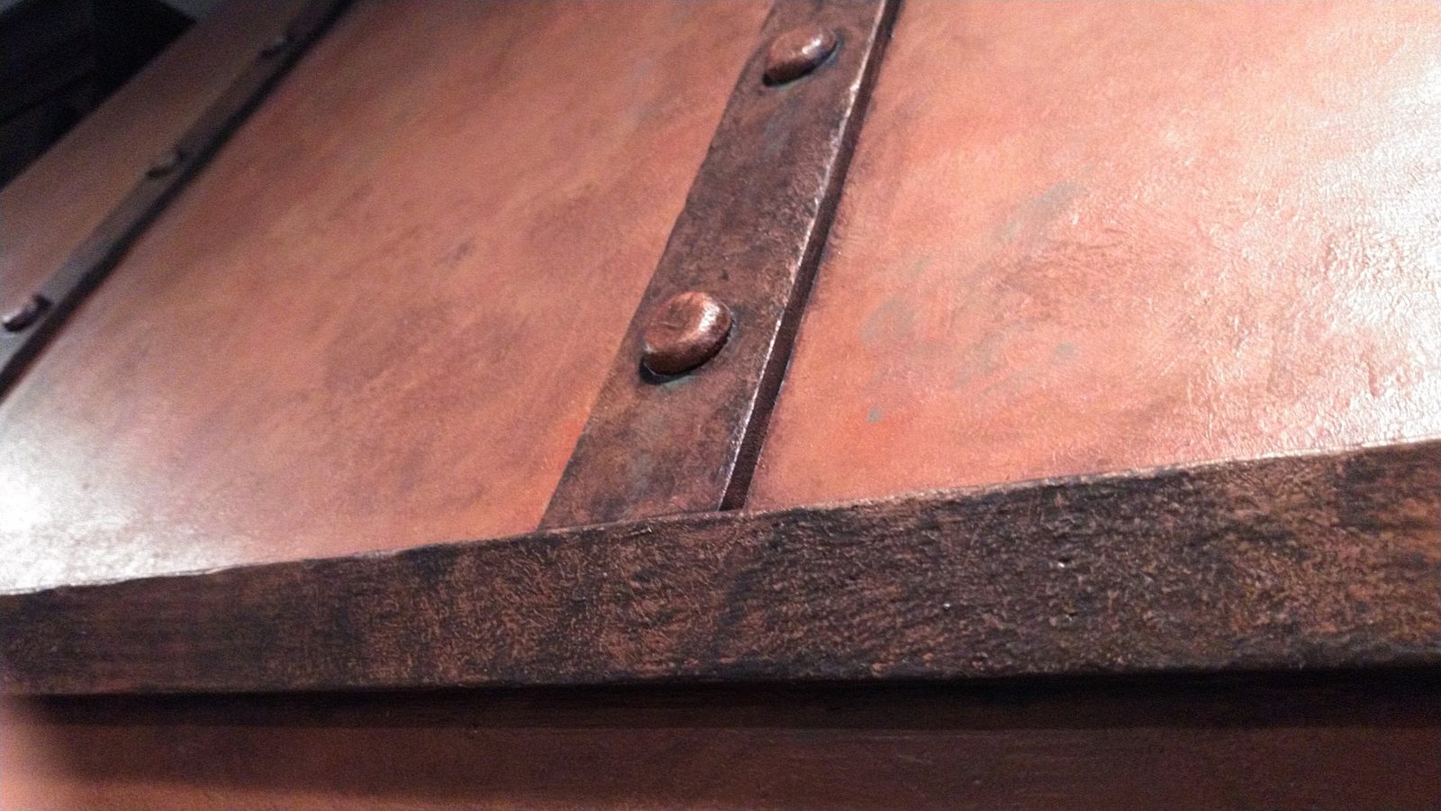 Copper Hood Detail — Hammered Panels & Iron Strapping