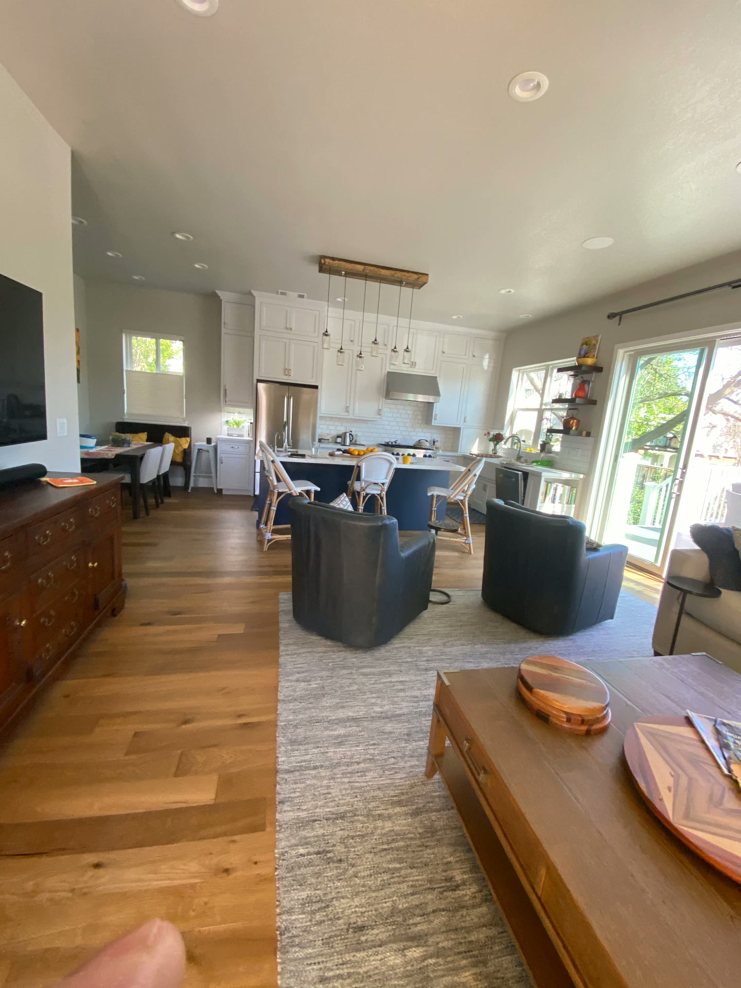 Open-Concept Kitchen — White Cabinets & Navy Island