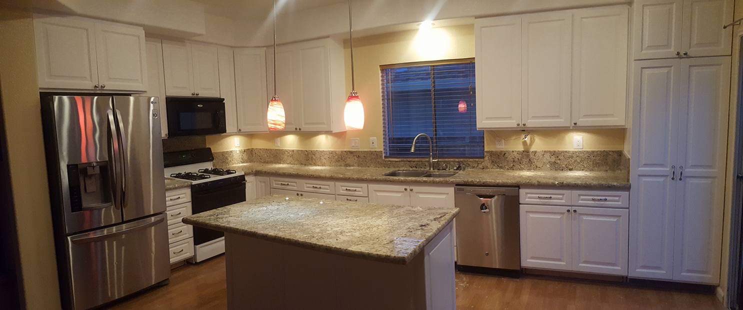 White Kitchen Remodel — Granite Island & Pendant Lights